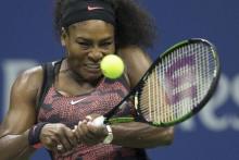 Serena Williams of the U.S. returns a shot to her sister and compatriot Venus Williams during their quarterfinals match at the U.S. Open Championships tennis tournament in New York, September 8, 2015. PHOTO BY REUTERS/Carlo Allegri
