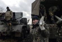 Ukrainian servicemen unload Grad rockets from a truck before launching them towards pro-Russian separatist forces outside Debaltseve, eastern Ukraine, February 8, 2015. PHOTO BY REUTERS/Alexei Chernyshev