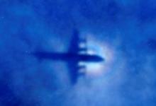 The shadow of a Royal New Zealand Air Force (RNZAF) P3 Orion maritime search aircraft can be seen on low-level clouds as it flies over the southern Indian Ocean looking for missing Malaysian Airlines flight MH370, March 31, 2014. PHOTO BY REUTERS/Rob Griffith