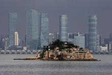 Shiyu, or Lion Islet, which is part of Kinmen county, one of Taiwan's offshore islands, is seen in front of China's Xiamen, on Lieyu island, Kinmen county, Taiwan, August 20, 2018. PHOTO BY REUTERS/Tyrone Siu