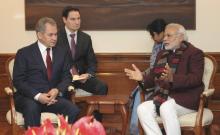 Indian Prime Minister Narendra Modi (R) speaks with Russia's Defence Minister Sergei Shoigu (L) during their meeting in New Delhi, January 21, 2015. REUTERS/India's Press Information Bureau