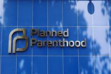 A sign is pictured at the entrance to a Planned Parenthood building in New York, August 31, 2015. PHOTO BY REUTERS/Lucas Jackson