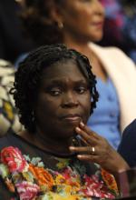 Ivory Coast's former first lady Simone Gbagbo (L) looks on as she attends the first day of her trial at the Palace of Justice in Abidjan December 26, 2014. Simone Gbagbo went on trial in Abidjan on Friday for her alleged role in stealing an election her husband lost in 2010 and resisting efforts to dislodge him in a civil war that followed. PHOTO BY REUTERS/Luc Gnago