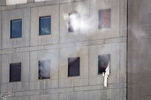 Smoke is seen during an attack on the Iranian parliament in central Tehran, Iran. PHOTO BY REUTERS/Tasnim News Agency