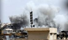 Smoke billows from the Islamic State militants positions after an artillery attack by the Iraqi soldiers in western Mosul, Iraq, June 18, 2017. PHOTO BY REUTERS/Erik De Castro