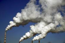 Smoke billows from the chimneys of a heating plant in Jilin, Jilin province, China, in this January 8, 2014 file photo. PHOTO BY REUTERS/Stringer