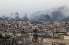 Smoke rises after airstrikes on the rebel-held al-Sakhour neighborhood of Aleppo, Syria, April 29, 2016. PHOTO BY REUTERS/Abdalrhman Ismail