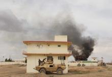 Smoke billows from a building after a Taliban attack in Gereshk district of Helmand province, Afghanistan, March 9, 2016. PHOTO BY REUTERS/Abdul Malik