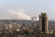 A general view shows rising smoke after strikes on Aleppo city, Syria, December 3, 2016. PHOTO BY REUTERS/Omar Sanadiki