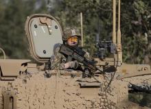 A British soldier keep watches at the site of a blast in Kabul, Afghanistan, August 22, 2015. PHOTO BY REUTERS/Mohammad Ismail
