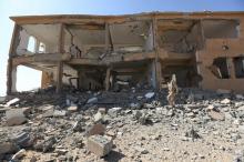 A soldier loyal to Yemen's President Abd-Rabbu Mansour Hadi walks past a destroyed building at the Mass army barracks after the pro-Hadi forces took it from Houthi rebels in the country's northwestern province of Marib, December 18, 2015. PHOTO BY REUTERS/Ali Owidha