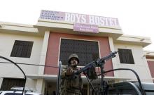 A soldier stands guard at the entrance to a dormitory where a militant attack took place, in Bacha Khan University in Charsadda, Pakistan, January 20, 2016. PHOTO BY REUTERS/Caren Firouz