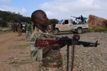 A soldier from Somalia's Puntland keeps guard on high grounds at the Galgala hills, during preparations for an offense against al Shabaab militants, north of the capital Mogadishu, January 8, 2015. PHOTO BY REUTERS/Abdiqani Hassan