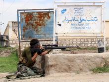 A member of Afghan security force takes his position during a battle with the Taliban on the outskirts of Kunduz province, Afghanistan, April 16, 2016. PHOTO BY REUTERS/Stringer