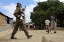 A Somali soldier patrols a street following a suicide car bomb and gun attack on in Afgoye, Somalia, October 19, 2016. PHOTO BY REUTERS/Feisal Omar