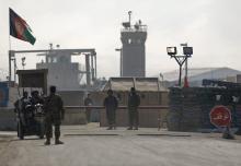Afghan National Army (ANA) soldiers stand at the Bagram detainee centre gate north of Kabul