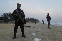 Soldiers stand in guard on the beach in Grand Bassam, Ivory Coast, March 13, 2016. PHOTO BY REUTERS/Luc Gnago