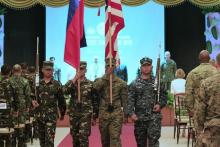 Soldiers carry a Philippine and U.S. flags during the exit of colours, as part of the opening ceremony of the 2016 Balikatan military exercises at the Armed Forces of the Philippines (AFP) headquarters in Camp Aguinaldo, Quezon city, metro Manila April 4, 2016. REUTERS/Romeo Ranoco
