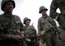 Ethnic Armenian soldiers are seen in a trench at artillery positions near the Nagorno-Karabakh's town of Martuni, April 7, 2016. PHOTO BY REUTERS/Staff