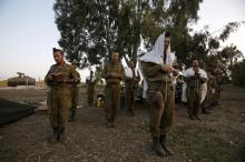 Israeli soldiers pray close to the ceasefire line between Israel and Syria on the Golan Heights, May 7, 2013. PHOTO BY RELIGION REUTERS/Baz Ratner