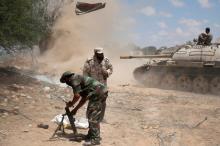 Libyan forces allied with the U.N.-backed government fire weapons during a battle with IS fighters in Sirte, Libya, July 21, 2016. PHOTO BY REUTERS/Goran Tomasevic