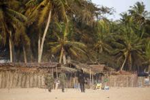 Soldiers walk on the beach after an attack in Grand Bassam, Ivory Coast, March 13, 2016. PHOTO BY REUTERS/Joe Penney
