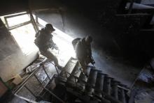 Members of the Iraqi rapid response forces inspect a hospital damaged by clashes during a battle between Iraqi forces and Islamic State militants in the Wahda district of eastern Mosul, Iraq. PHOTO BY REUTERS/Alaa Al-Marjani