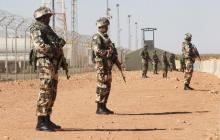 Algerian soldiers are seen at the Tiguentourine Gas Plant in In Amenas, 1600 km (994 miles) southeast of Algiers, January 31, 2013. PHOTO BY REUTERS/Louafi Larbi