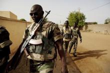 Soldiers from the Waraba Battalion, an EU-trained Malian army battalion, walk outside their base in Gao, July 8, 2013. PHOTO BY REUTERS/Malin Palm