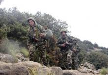 Soldiers arrive at the site of a military plane crash near the village of Ouled Gacem in eastern Algeria, about 500km (311 miles) from the capital Algiers, February 12, 2014. PHOTO BY REUTERS/Louafi Larbi