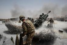 U.S. Army soldiers from the 2nd Platoon, B battery 2-8 field artillery, fire a howitzer artillery piece at Seprwan Ghar forward fire base in Panjwai district, Kandahar province southern Afghanistan, June 12, 2011. PHOTO BY REUTERS/Baz Ratner