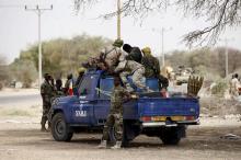 Chadian soldiers, part of a West African task force fighting Boko Haram militants, sit in a military pickup truck in Damasak in northeastern Nigeria, March 24, 2015. PHOTO BY REUTERS/Joe Penney