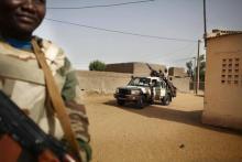Soldiers from the Waraba Battalion, an EU-trained Malian army battalion, ride in military vehicles in Gao, July 8, 2013. PHOTO BY REUTERS/Malin Palm