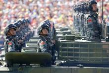 Soldiers of the People's Liberation Army (PLA) of China look towards their president at the Tiananmen Square during the military parade marking the 70th anniversary of the end of World War Two, in Beijing, China, September 3, 2015. PHOTO BY REUTERS/Damir Sagolj