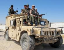 Afghan security forces arrive to fight with Taliban forces in Helmand, Afghanistan, October 21, 2015. PHOTO BY REUTERS/Stringer