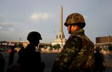 Soldiers stand guard at the vicinity of the Victory Monument in Bangkok, June 2, 2014. PHOTO BY REUTERS/Erik De Castro