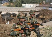 Indian army soldiers stand guard near the Indian Air Force (IAF) base at Pathankot in Punjab, India, January 3, 2016. PHOTO BY REUTERS/Mukesh Gupta