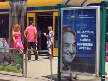 Hungarian government poster portraying financier George Soros and saying "Don't let George Soros have the last laugh" is seen at a tram stop in Budapest, Hungary, July 6, 2017. PHOTO BY REUTERS/Krisztina Than