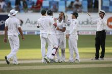 South Africa's JP Duminy (C) and teammates celebrate their victory over Pakistan during the second test cricket match in Dubai