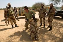 A U.S. special forces soldier demonstrates how to detain a suspect during Flintlock 2014, a U.S.-led international training mission for African militaries, in Diffa, Niger, March 4, 2014. PHOTO BY REUTERS/Joe Penney