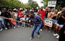 Students protest over planned increases in tuition fees in Stellenbosch, October 23, 2015. PHOTO BY REUTERS/Mike Hutchings