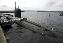 French Marine officers wait atop "Le Vigilant" nuclear submarine prior to the visit of France's President Nicolas Sarkozy at L'Ile Longue military base, near Brest western France, July 13, 2007. PHOTO BY REUTERS/Francois Mori