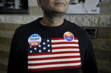 A supporter of U.S. Republican presidential candidate Donald Trump waits to enter the auditorium at the Bridge View Center ahead of a campaign event in Ottumwa, Iowa, January 9, 2016. PHOTO BY REUTERS/Mark Kauzlarich