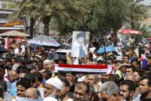 Supporters of prominent Iraqi Shi'ite cleric Moqtada al-Sadr shout slogans during a protest against government corruption after Friday prayers in Baghdad's Sadr City, April 8, 2016. PHOTO BY REUTERS/Ahmed Saad