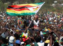 Zimbabwe's President Robert Mugabe and his wife Grace greet supporters of his ZANU (PF) party during the "One Million Man March", a show of support of Mugabe's rule in Harare, Zimbabwe, May 25, 2016. PHOTO BY REUTERS/Philimon Bulawayo