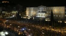 ATHENS (Reuters) - Greeks overwhelmingly rejected conditions of a rescue package from creditors on Sunday, throwing the future of the country's euro zone membership into further doubt and deepening a standoff with lenders.  Stunned European leaders called a summit for Tuesday to discuss their next move after the surprisingly strong victory by the 'No' camp defied opinion polls that had predicted a tight contest.  The euro currency and stock prices in Asia fell sharply in early trade, although dealers emphas