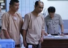 Human trafficking suspect Patchuban Angchotipan, a former official in the provincial government of the southern province of Satun, walks near a prison cell at the criminal court in Bangkok, Thailand, March 15, 2016. PHOTO BY REUTERS/Chaiwat Subprasom