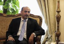President of the Syrian National Coalition Ahmad Al-Jarba looks on during his meeting with Egypt's Foreign Minister Nabil Fahmy (not pictured) in Cairo