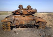 A destroyed T-72 tank, which presumably came from Russia, is seen on a battlefield near separatist-controlled Starobesheve, eastern Ukraine, October 2, 2014. PHOTO BY REUTERS/Maria Tsvetkova