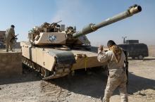 An Iraqi security forces' member directs a tank in the liberated part of Albu Saif village south of Mosul, Iraq February 21, 2017. REUTERS/Zohra Bensemra